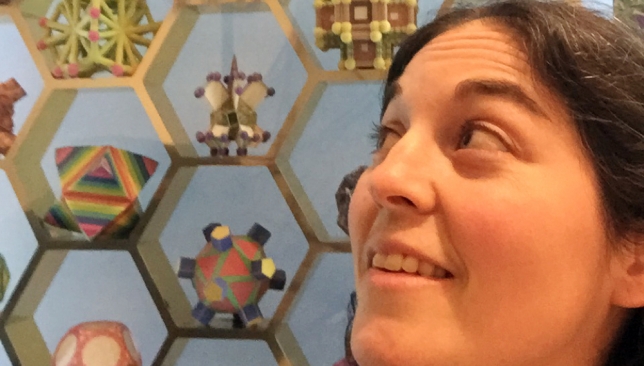 Louisa looking over her shoulder at shapes.